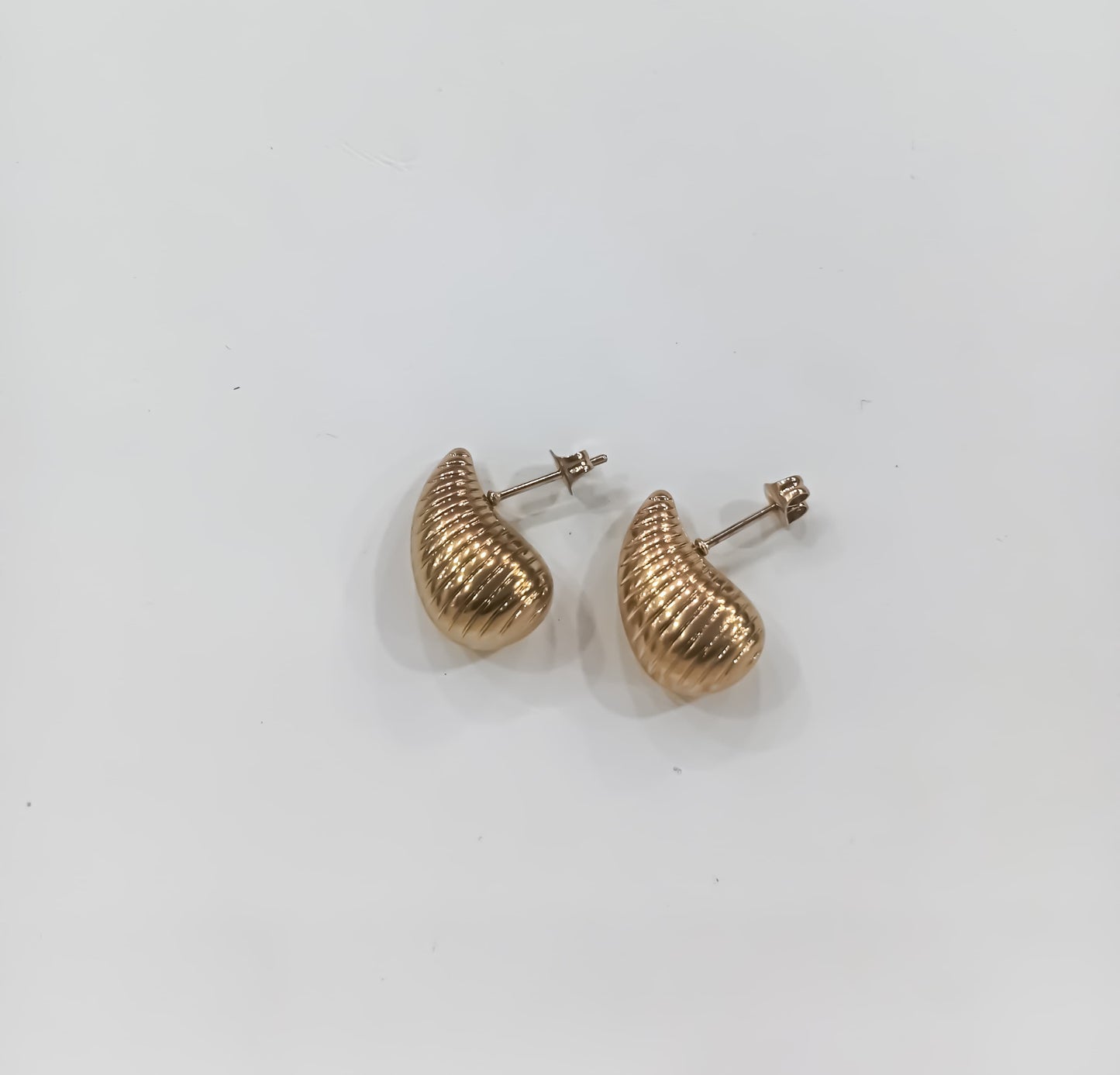 Golden Ripple Hoops – Sculpted Elegance in Steel